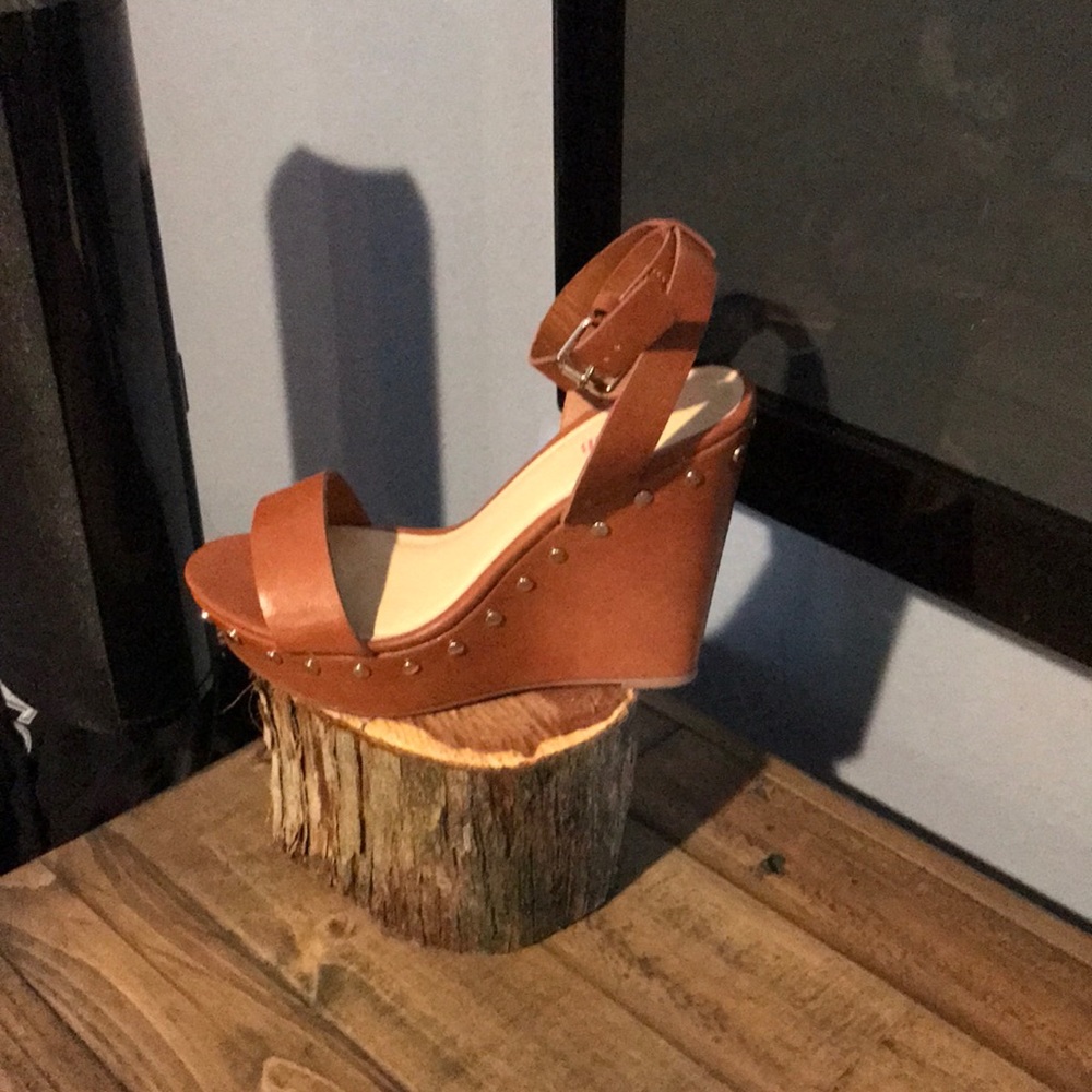 Light brown wedge heels with gold buttons